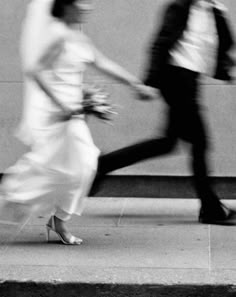 newly married couple running
