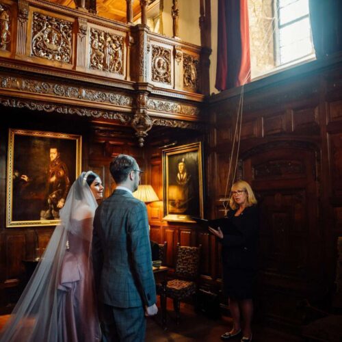 Couple being married in a unique indoor wedding ceremony space