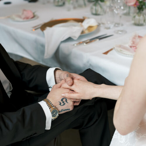 Newly married couple holding hands
