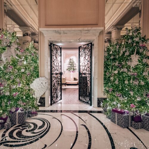 Entrance to Langham London Hotel with Christmas trees